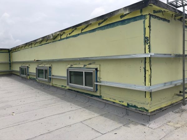 Commercial roof and wall replacement in progress