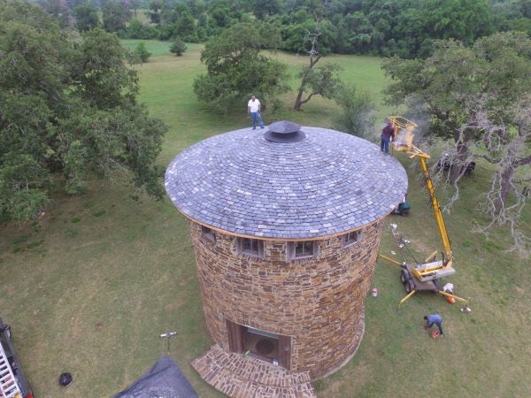 Completed shingles on historic brick tower